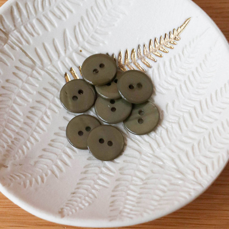 Flat mother-of-pearl buttons with 2 holes