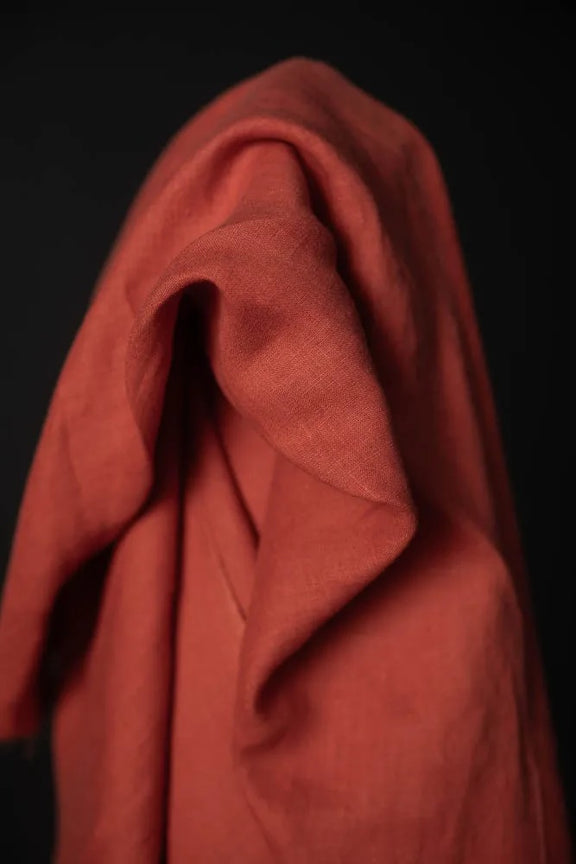 Red fabric draped over a black background