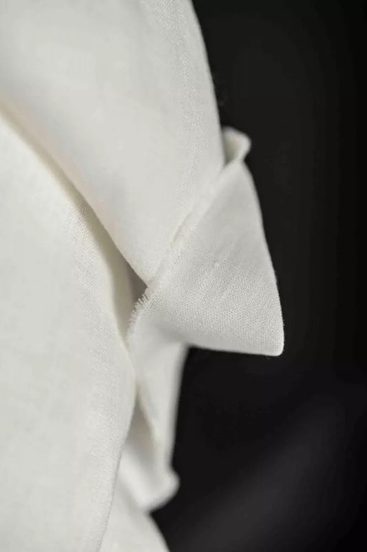 Close-up of a white fabric with a dark background